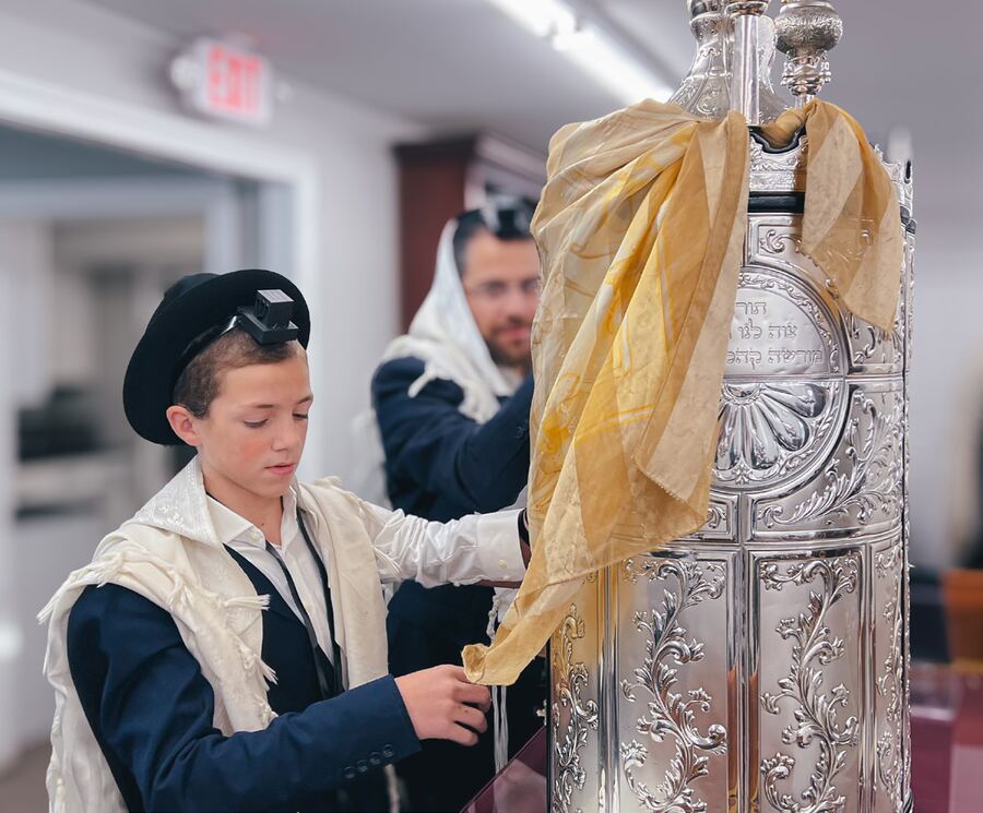 A boy at the Sefer Torah